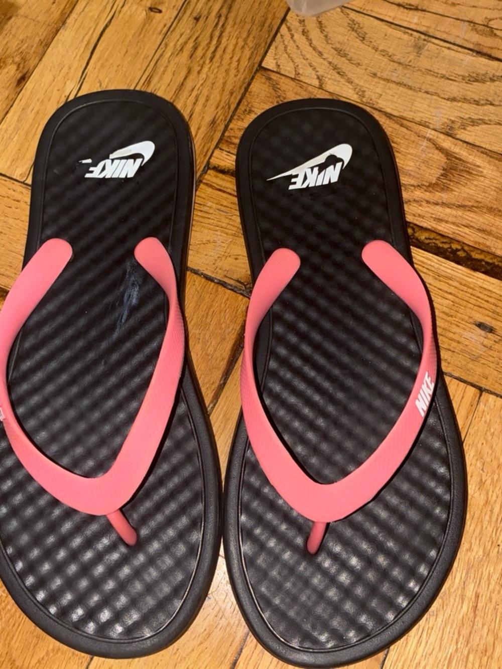 Nike Women’s Black Flip-Flops with Coral Pink Straps
